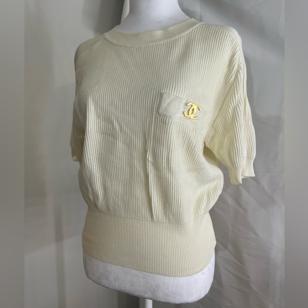 CHANEL Boutique Cream Knit Top w/ Large CC Medallion